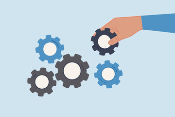Business solution to fix problem, businessman hand put important gear to make machine run good