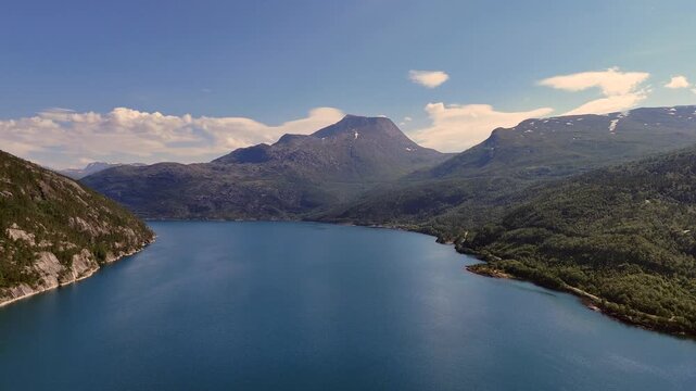 Aerial view of Rombaksbotn bay near Narvik with calm blue waters and surrounding mountains in Norway