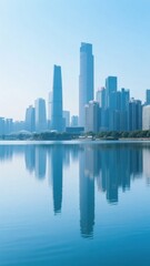 Modern city skyline reflected in calm blue water under clear sky