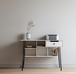 a white minimalist desk with black details, featuring an open shelf and minimal accessories like paper clips or an inkjet printer on the right side of it.