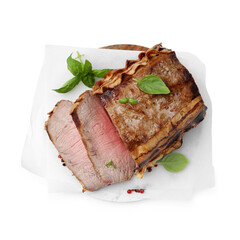 Delicious baked beef meat and spices isolated on white, top view