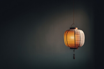 Obraz premium single paper lantern glows softly in dark