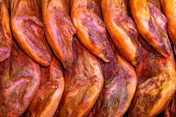 Hams hanging in a charcuterie store