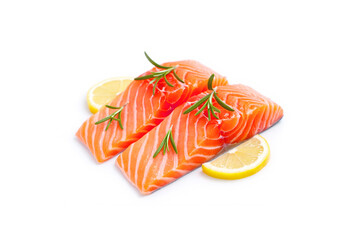 Fresh salmon fillet, spices and lemon slices on white background