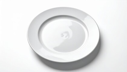 Simple white ceramic plate on a white background, ideal for minimalist kitchen and dining themes.