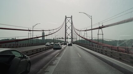 traffic crossing the april 25th bridge in Lisbon.