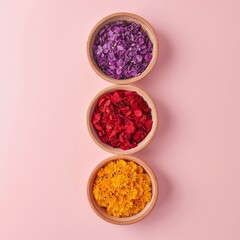 Wooden Bowls with Colorful Pieces on Pink Background