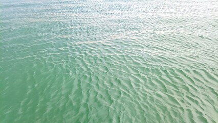 Calm ocean water with smooth flowing waves, providing a peaceful and soothing coastal atmosphere