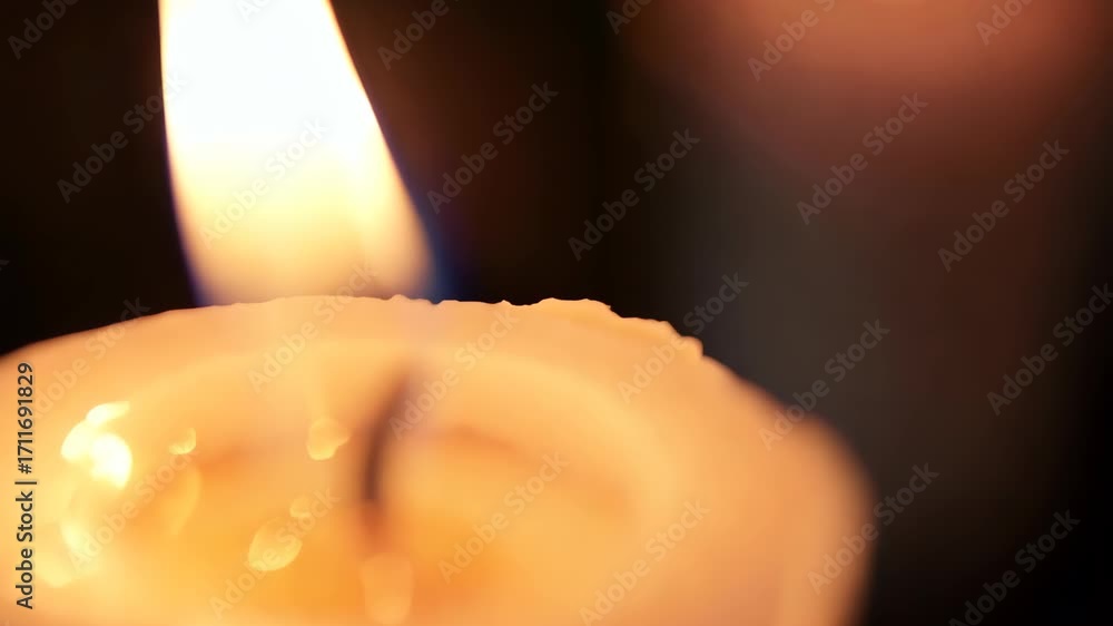 Poster this close-up image captures the mesmerizing flicker of a candle flame in a darkened environment, cr