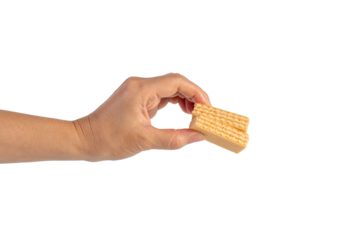 Wafer biscuit with chocolate cream and hand isolated on transparent background