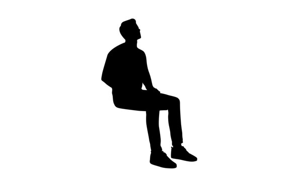 Silhouette of a man sitting down, looking up, isolated on a white background, side view