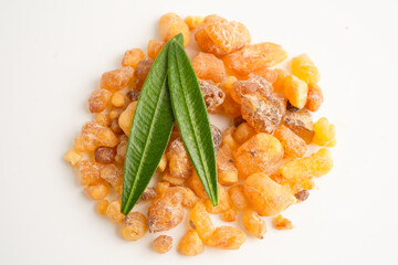 Frankincense or olibanum aromatic resin isolated on white background used in incense and perfumes.