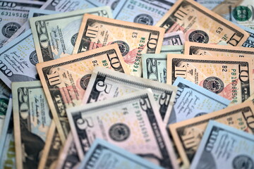 Big amount of different dollar bills close up. Hundred fifty twenty ten and five dollar banknotes