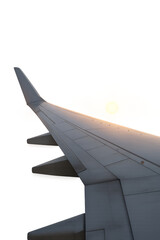Airplane wing soaring at sunset with transparent background