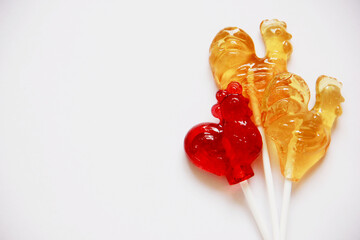 Red and yellow candy. Lollipops on white background