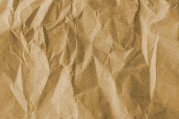 Brown crumpled recycled paper texture background. Kraft Paper