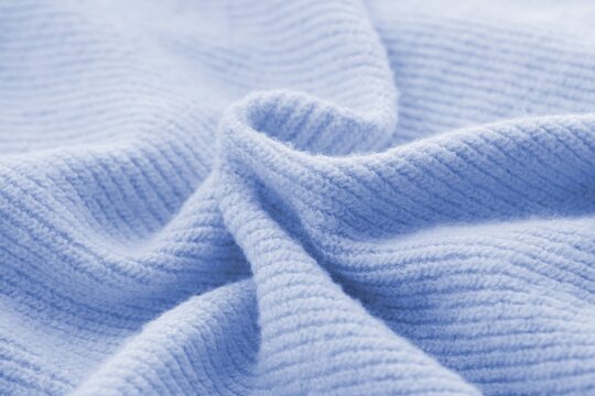Knitted cashmere blue fabric texture with large fold