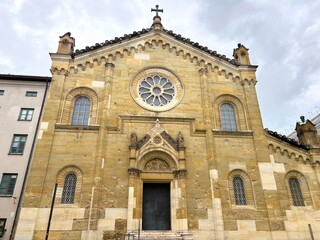 Looking up at the upholstered walls of the facade of the old Catholic church All Saints' Court Church in Munich.