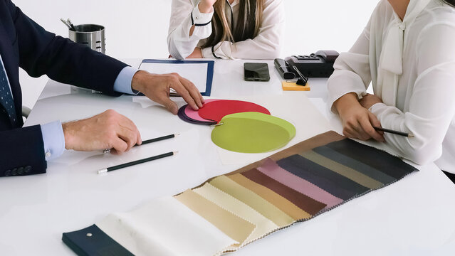Creative business meeting focused on color selection for project development