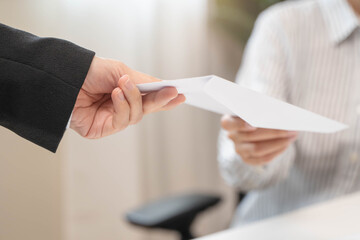 female employee smiling when she receive salary from boss.