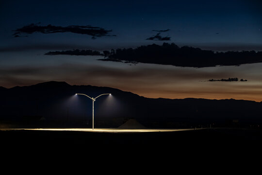 Lone lamp post along a lonely highway