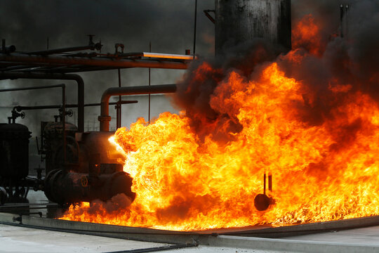 Firefighters practice in a refinery