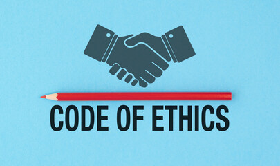 A red pencil is placed next to a hand holding another hand