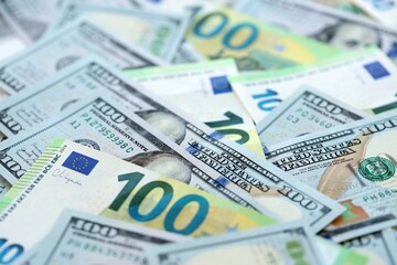 Big pile of Euro and USD banknotes. Many european and united states dollars