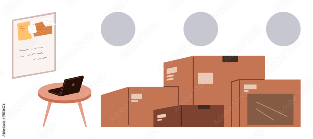 Poster workspace with a laptop on a round table alongside a bulletin board and stacks of cardboard boxes. i