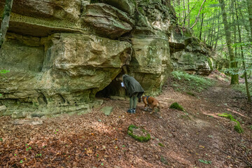 Beautiful green forest Hiking path with Sandstone chalk rock formations in Berdorf Mullerthal Luxembourg