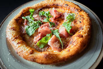 Delicious pizza in ceramic plate : A close-up shot of a delectable pizza, freshly baked and...