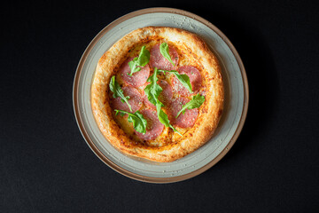 Pizza Perfection: A close-up, high-angle shot showcases a delectable pizza, artfully arranged with fresh ingredients, capturing the essence of Italian culinary artistry.