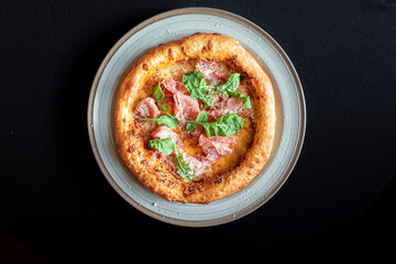 Pizza Delight: A close-up shot of a perfectly crafted pizza, boasting a golden-brown crust, fresh ingredients and a simple elegance that will make your taste buds yearn for a single slice.