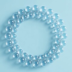 Fototapeta premium Clear glass spheres arranged in a circle on a light blue background