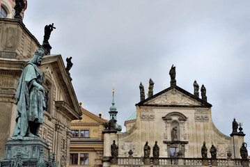 Fototapeta premium Sculpture of Holy Roman Emperor Charles IV in front of St. Francis Seraph Church of Assisi in Prague, Czech Republic
