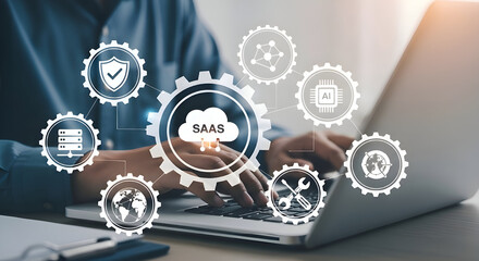 Person typing on laptop with saas cloud icon and connected technology icons overlaying the image