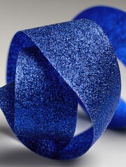 Deep blue textured ribbon in a knot