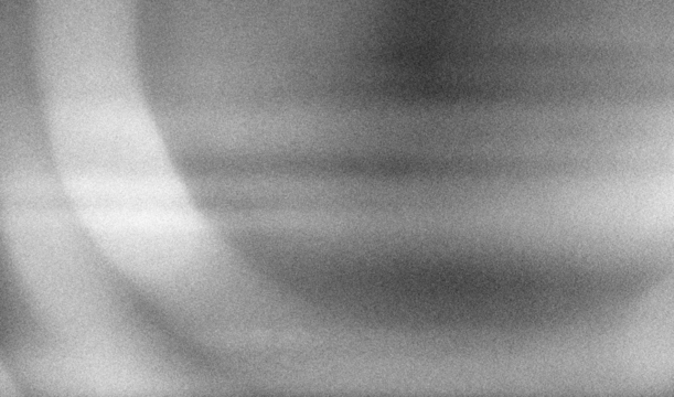 Stippled grain texture background. Black sprayed dots gradient wallpaper. Rough noisy sand dotted backdrop.