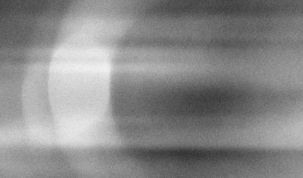 Stippled grain texture background. Black sprayed dots gradient wallpaper. Rough noisy sand dotted backdrop.