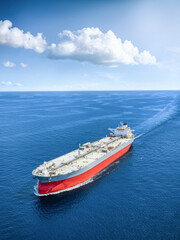 Aerial view of a large super tanker for crude oil or chemical goods traveling over the ocean