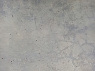 Dry cracked texture on a gray polished concrete floor