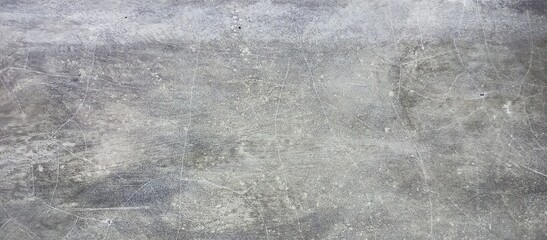 Abstract cracked texture on a gray concrete wall