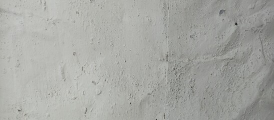Chipped and peeling paint on a textured wall