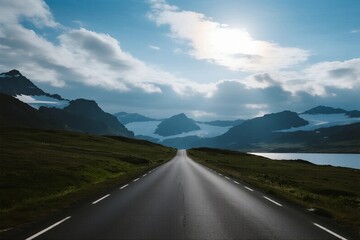 Fototapeta premium A scenic road stretching through mountainous and cloudy landscape