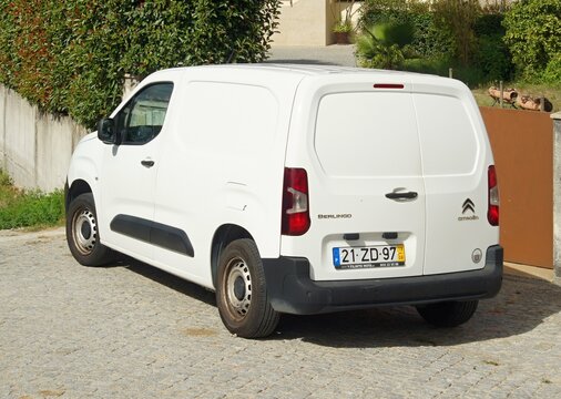 White Citro&euml;n Berlingo parked on a cobblestone driveway