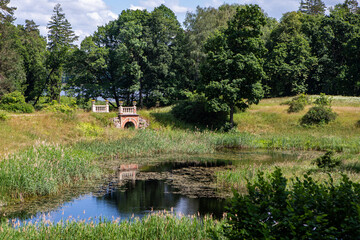 Scenic view of Uzutrakis manor park with bridge and pond, Trakai, Lithuania