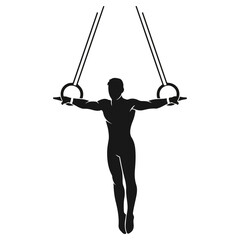 Gymnast performing on rings with focused determination and strength.