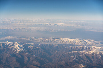 Obraz premium Plane Window View, Snow Mountains Aircraft Fly Landscape, Looking from Plane Cabin