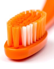 Close-up of an orange toothbrush head