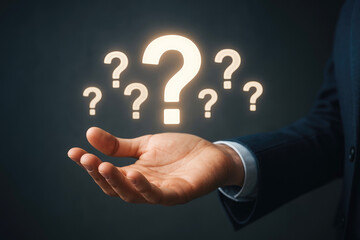 Hand Presenting Multiple Glowing White Question Marks Against Dark Gradient Background open hand holding
